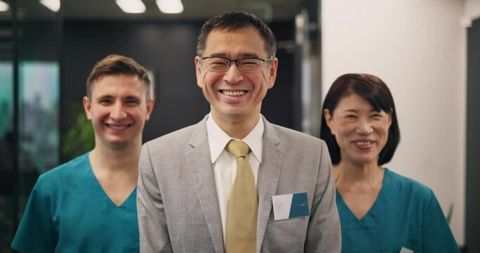 Happy, doctor and internship with medical team, confidence or ambition for healthcare service at hospital. Portrait, group or health workers with smile for development or clinic program in Japan