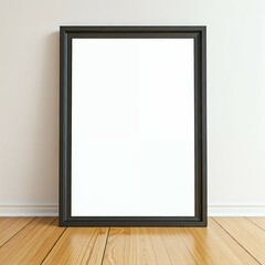 A blank, black-framed picture on a white wall above a wooden floor.