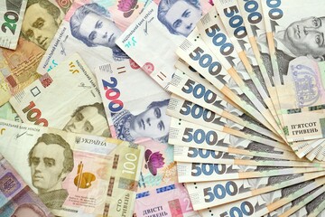 Big amount of different ukrainian hryvnia currency money bills in pile