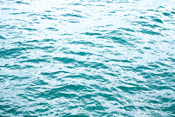 Blue water reflection. Blue ocean wave. Summer sea. Sea surface. Blue water texture. Close up blue water surface at deep ocean. Ocean water texture background.