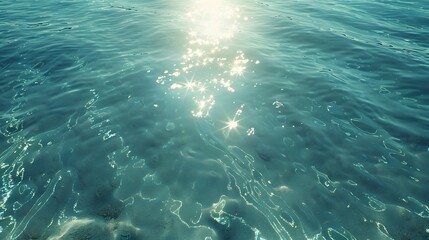 Fototapeta premium Blue water surface with sparkling sun reflection.