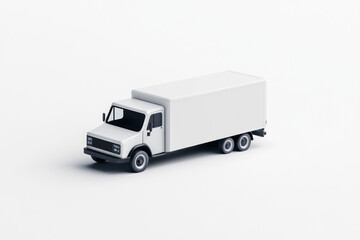 White truck pulling a white trailer, parked beside a lush green field under a clear blue sky.