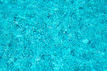 Water view. Transparent water background. Blue pool water texture background. Surface of pool water with ripples.