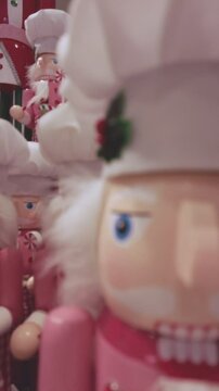A close up of a Christmas nutcracker with a gingerbread man on top
