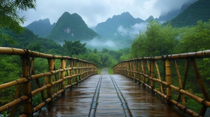 Fototapeta premium Bamboo bridge in misty mountains.