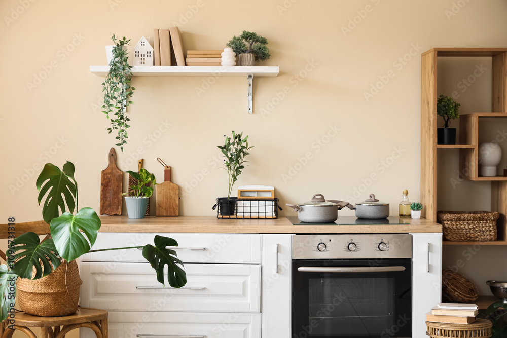 Wall mural White counters, oven, shelving unit and utensils in interior of beautiful kitchen