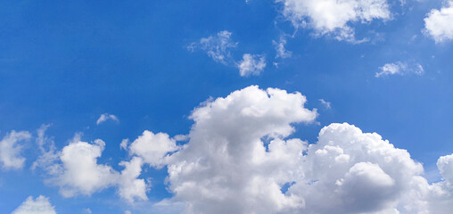 blue sky with clouds, a blue sky with white clouds and a plane