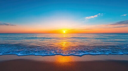 Fototapeta premium The sun is setting over the ocean, casting a warm glow on the water