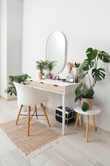 Interior of room with makeup table and plants