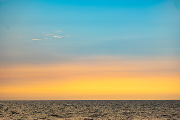 Enjoy a panoramic view of the skyline. The sun rises in the morning sky with colorful clouds. and beautiful cloud patterns In the soft light of the morning	