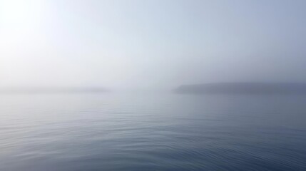 Fototapeta premium Misty Morning at Sea with Soft Reflections