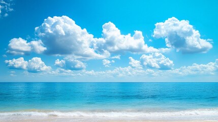 Obraz premium Serene Beach with Golden Sands and Blue Sky