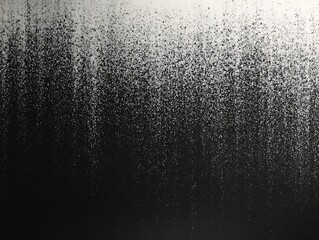 Obraz premium Abstract black and white gradient texture with scattered dots.