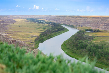 View to the river in the valley among badlands from the top of the hill.