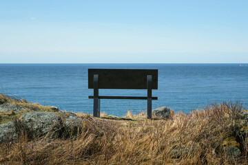 Scenic View of the Atlantic Ocean from a Park Bench on the Shores of Canada
