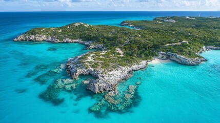Aerial drone shot of a small lush tropical island surrounded by crystal clear turquoise blue waters and sandy beaches  Picturesque and serene natural landscape in a remote and secluded paradise