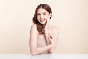 Beautiful young asian woman with clean fresh skin on beige background, Face care, Facial treatment, Cosmetology, beauty and spa, Asian women portrait.