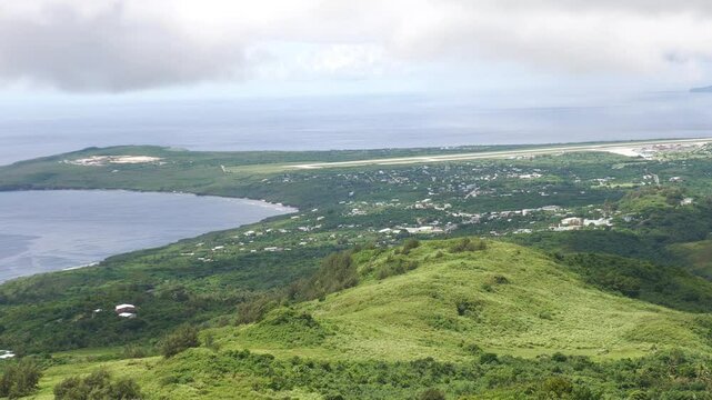 Aerial view of Saipan southern coast, with the Saipan International Airport runway in view.