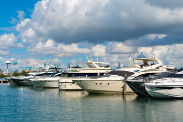 Luxury yacht boat moored at harbor pier in Miami beach summer marina, Florida