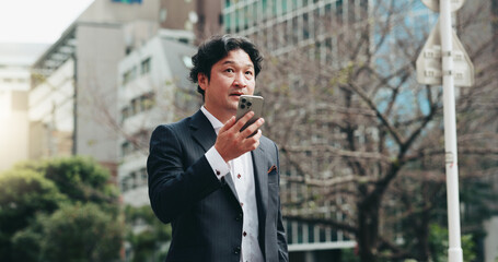 Japanese, business and man with phone speaker for discussion, schedule update and negotiation chat. Male person, mobile sound and communication of audio, contact information and urban travel in Japan