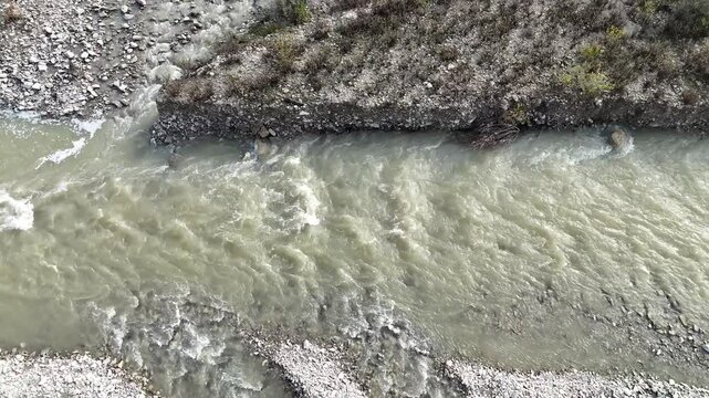 river flowing through a rocky landscape, creating dynamic patterns and textures, Arda River in Val Tolla, Lugagnano D'Arda, Piacenza, Italy, static shot
