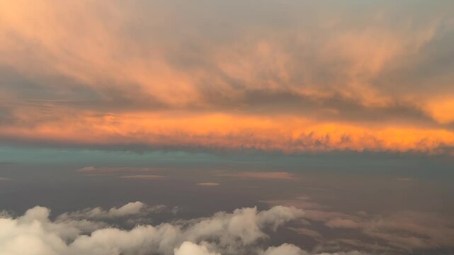 Immersive pilot&rsquo;s FPV flying though an early morning sky with some golden color clouds illuminated by the sunrise light. 4K 60FPS
