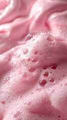 Fototapeta premium Close-up of pink, foamy texture with bubbles.