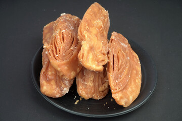 Famous khaja of puri in black plate