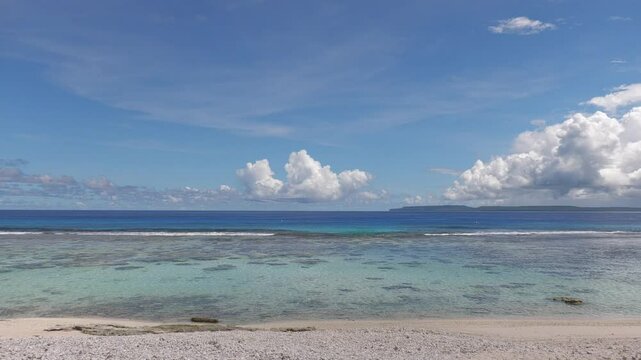 Coral Ocean Point Beach with its pristine waters, the island of Tinian in the distance, Saipan, Northern Mariana Islands.