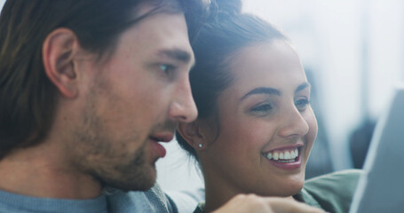 Home, sofa and couple with tablet for comedy, streaming and bonding together with entertainment. Happy people, man and woman with laughing for digital joke, watching movie and connection in marriage