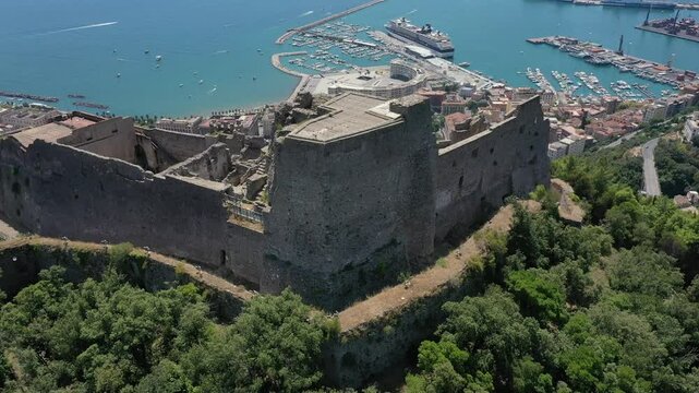 Aerial view from high altitude of Salerno city center and Arechi Castle on the mountain, Italy