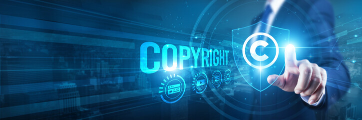 Copyright. Businessman hand touches a shield, Copyright protection intellectual property. The...
