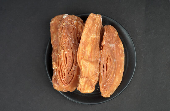 Top view of Special Khaja of Puri in black background