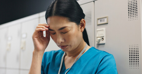 Fototapeta premium Japanese, woman and surgeon with headache in hospital of healthcare stress, medical mistake and burnout risk. Nurse, depression and anxiety of surgery crisis, bad news and treatment disaster in Japan