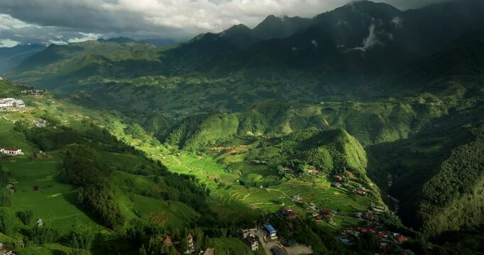 Aerial View Of Village Settlements Down The Lush Hoang Lien Son Mountains of Northwestern Vietnam.