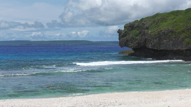 Scenic view of the Ladder Beach, with the island of Tinian in the distance. Saipan, Northern Mariana Islands