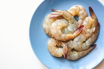 Peeled shrimp  Fresh shrimp in ceramic plate ,Fresh prawn raw seafood  on white background