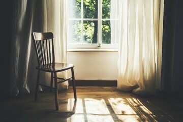 Fototapeta premium Wooden chair near sunlit window, sheer curtains.