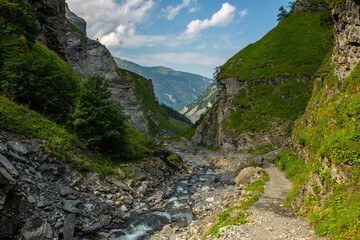 Rocky mountain stream valley in Alps, tranquil trekking trail in Switzerland