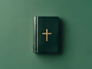 Obraz premium A minimalist image of the Bible isolated against a solid green background. The book's simple leather-bound cover and cross emblem stand out