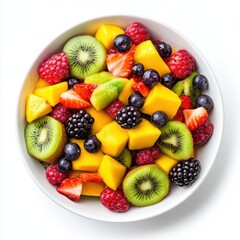 Obraz premium A bowl of fresh fruit salad with mango, kiwi, strawberries, raspberries, and blueberries.
