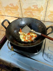 frying pan with meat and vegetables