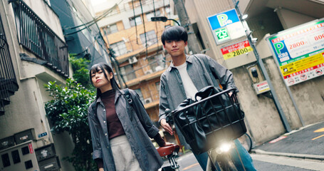 Obraz premium Fashion, bike and portrait of Japanese couple in city for streetwear, genz style and summer. Date, urban travel and love with asian man and woman and outdoors for bonding, casual and cool together