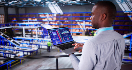 Engineer Worker Using Warehouse Automation Dashboard