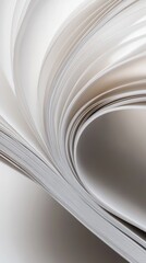 Close-up of a book's pages turning, showing soft white paper and a gentle curve.