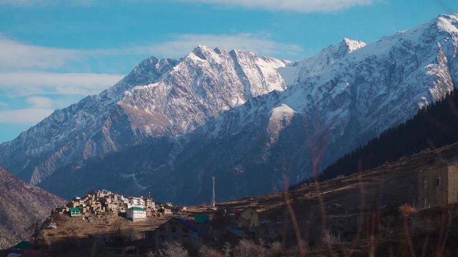 Triloknath village under the snowy Himalayan mountain peak at Lahaul and Spiti district in Himachal Pradesh, India. Beautiful village under the snowy Himalayan mountain peaks during the winter season.