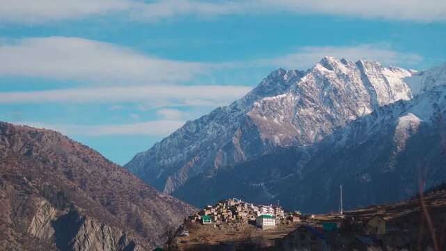 Triloknath village under the snowy Himalayan mountain peak at Lahaul and Spiti district in Himachal Pradesh, India. Beautiful village under the snowy Himalayan mountain peaks during the winter season.