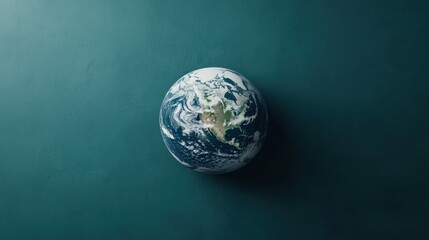 Fototapeta premium Global Planet Earth on Teal Background Sustainability Ecology Conservation