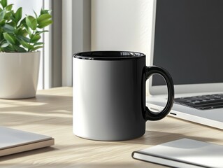 Obraz premium Blank black and white coffee mug on wooden desk next to laptop.