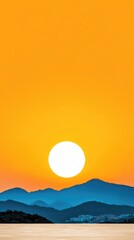 Stunning Sunset Over Mountain Range with Vibrant Orange Sky and Silhouetted Peaks in Serene Landscape